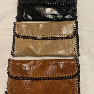 Real leather either hand bags or over the shoulder bag
